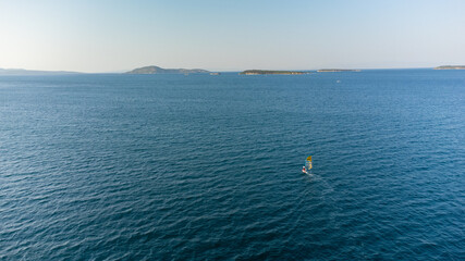 aerial view of Windsurfing, extreme sports. Water sports. Athlete in competition. Seascape with...