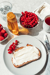 Bread with soft cheese and honey on top. Healthy breakfast concept.
