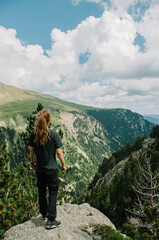 Fototapeta premium hiker in the mountains with rasta dreadlock