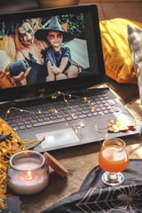 Halloween online virtual holiday remote celebration halloween in lockdown home quarantine covid 19 new normal, social distance, remote communication,stay home vocation halloween selective focus