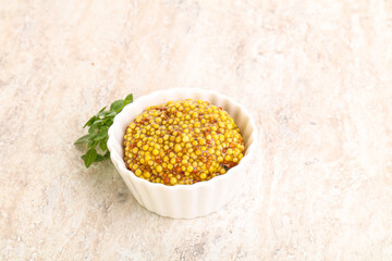 Grain mustard sauce in the bowl