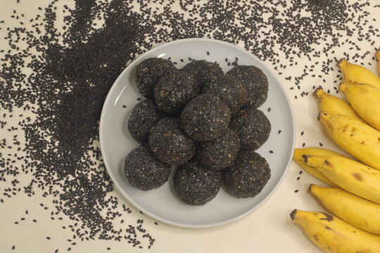 Traditional Indian sweet balls made with sesame seeds, jaggery and coconut, commonly known as Til ke laddu or sesame ladoos