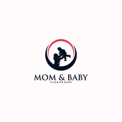 Fototapeta premium Mother holding a little baby logo design vector