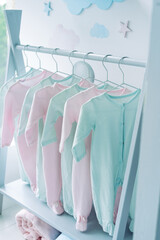 Babies clothes on the rack in the kids room
