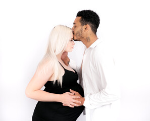 Stylish and happy multi-ethnic couple expecting a baby