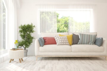 Minimalist living room in white color with sofa and summer landscape in window. Scandinavian interior design. 3D illustration