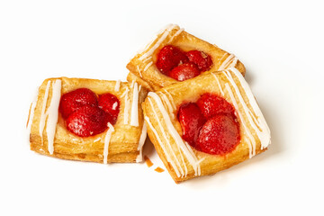 Puff pastry pies with strawberries on a White background. Puff pastry filled. Photo.