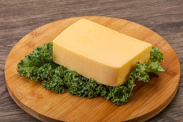 Tasty yelloow Tilsiter cheese brick