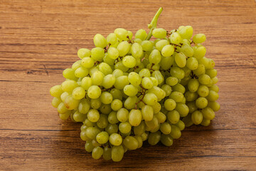 Green grape branch over background