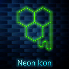 Glowing neon line Honeycomb icon isolated on brick wall background. Honey cells symbol. Sweet natural food. Vector