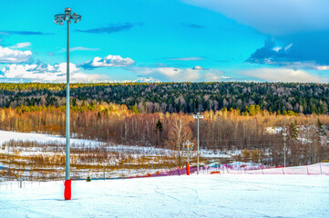 Stunning view of the forest from the ski resort. Travel on vacation.Ski slope, steep descent in...