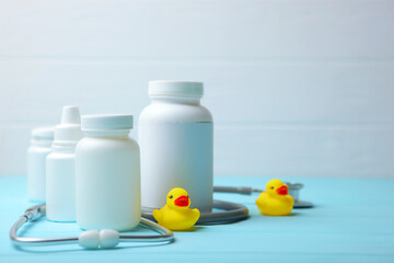  Pediatrics concept. Stethoscope and toy on a light background