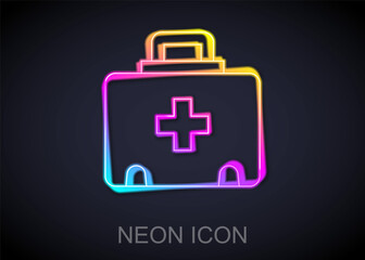 Glowing neon line First aid kit icon isolated on black background. Medical box with cross. Medical equipment for emergency. Healthcare concept. Vector