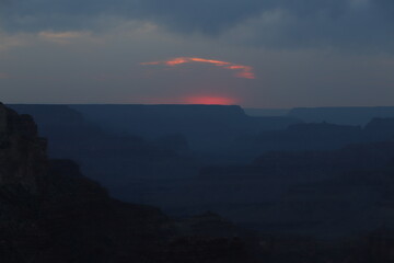 Yavapai Point on the South Rim of the Grand Canyon  in Arizona at Dusk with a Pink Glow on the Mountains Horizon after Sunset