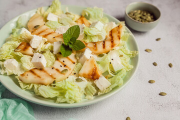 fresh summer grilled melon and cheese salad, close up view, soft focus