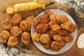 Plantain fritters. Plantain slices dipped in whole wheat flour batter and deep fried in coconut oil.