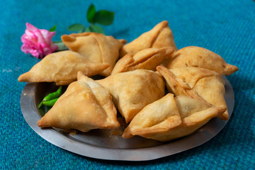 Homemade Samosa, samsa or smosa. A vegetarian spicy Indian special traditional street food. Iftaari dish, Selective focus.