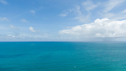 Obraz premium Beautiful air sunlight with blue sky and clouds background.Landscape Sunset colorful cloudy summer.Waves sea water crashing beach texture Background.Close up no people.