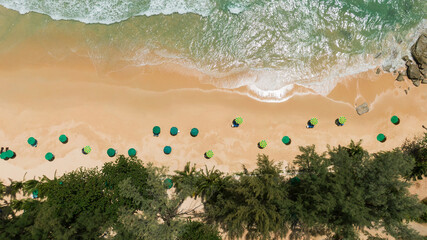 Top view.Panorama beautiful beach with white sand on sunny day. palm trees umbrellas sunset  summer holiday. 