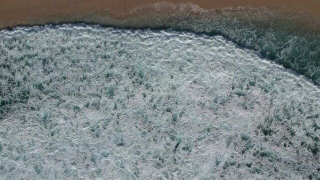 Aerial drone topdown of waves breaking, white water and cool patterns created at Salmon holes beach, Albany Western Australia