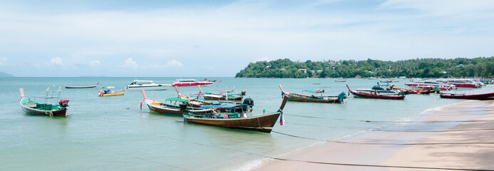 boats in the bay.Famous landmark in summer of tropical island.Tourists on the best beaches in Phuket, Thailand.