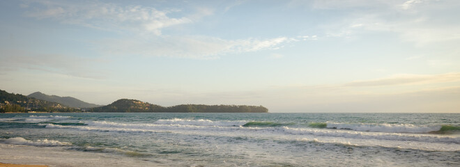 winter landscape with snow covered trees.tropical sundown over the sea cloud and waves golden beach.