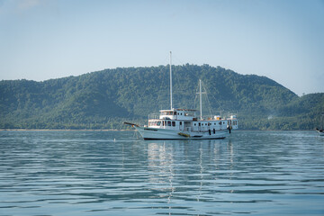 Fototapeta premium boat on the lake.yacht in the sea.summer vacation and holiday concept. Tourists on the best beaches in Phuket,Thailand.