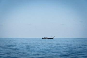 Thai traditional wooden longtail boat and beautiful sand.