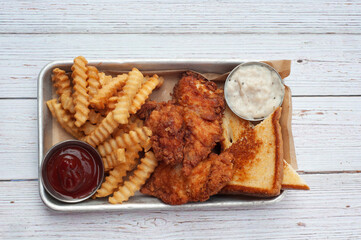 Fried chicken sandwich with fries