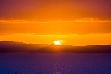 Fototapeta na wymiar Colourful sunset over northern european sea in Norway