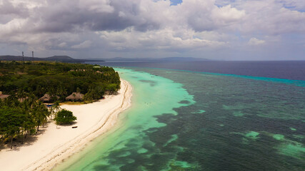 Aerial drone of coast, turquoise sea and sand beach. Panglao island, Bohol, Philippines.