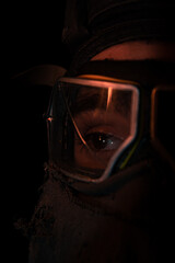 Fototapeta premium Fire reflection in a gas mask macro 