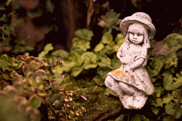 Garden sculpture depicts the figure of a beautiful young woman (not the author's work)