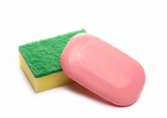 Red soap bar and yellow cleaning sponge isolated on white background