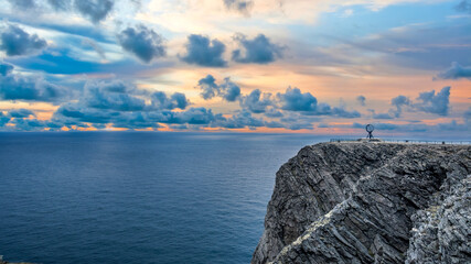 Midnight sun at North Cape Nordkapp on the northern point of Norway and Europe with Barents Sea, a...