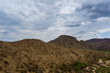 Fototapeta na wymiar Panoramic view of desert valley mountains landscape with cactus in the Arizona, United States