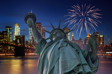Fototapeta premium Firework over city at night with Statue of Liberty in Manhattan New York City USA s over Manhattan
