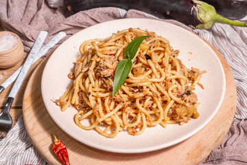 Traditional Sicilian pasta dish of sauteed eggplant topped with tomato sauce
