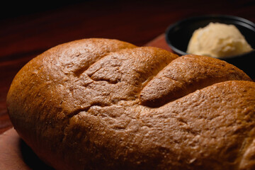 loaf of bread on a wooden board