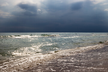 Heavy leaden clouds with rain over the blue sea. Typhoon over the Black Sea.