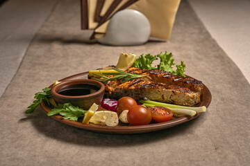 Salmon steak with sauce, vegetables and herbs