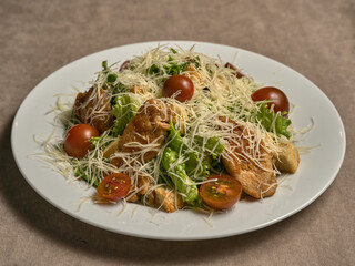 Georgian salad with grated cheese, lettuce and tomatoes
