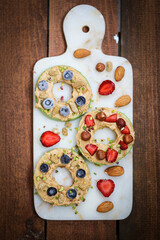 Delicious strawberry tart with pastry cream, on a white concrete background. 