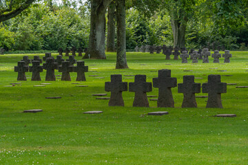Naklejka premium La Cambe, France - 08 03 2021: Normandy German military cemetery and Memorial and the black crosses