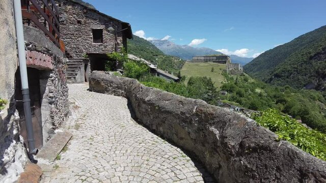 Scenic sight in Exilles with the fort in the background, Val di Susa (Susa Valley), Piedmont, Italy.