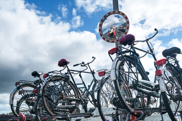 Fototapeta premium Floating bicycle shed behind Central Station in Amsterdam, Noord-Holland province, The Netherlands