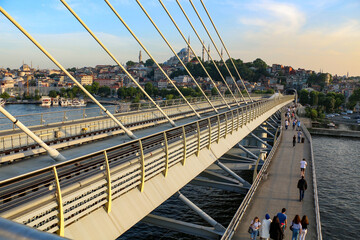 Fototapeta na wymiar selective focus, 26.06.2021 ISTANBUL, Turkey: Eminonu Golden Horn metro, silhouettes of istanbul mosques from the metro station bridge 