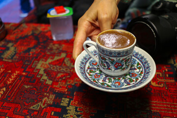 selective focus, Turkish coffee cooked on charcoal for tourists in Eminönü	
