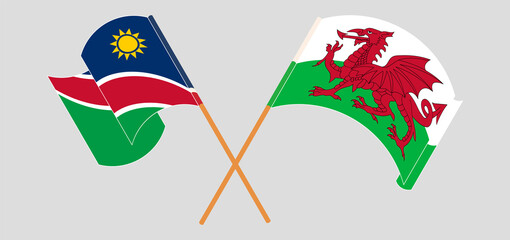 Crossed and waving flags of Namibia and Wales