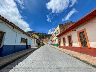 Fototapeta na wymiar Amazing photo of an empty street in the La Candelaria colorful neighborhood in Bogota, Colombia